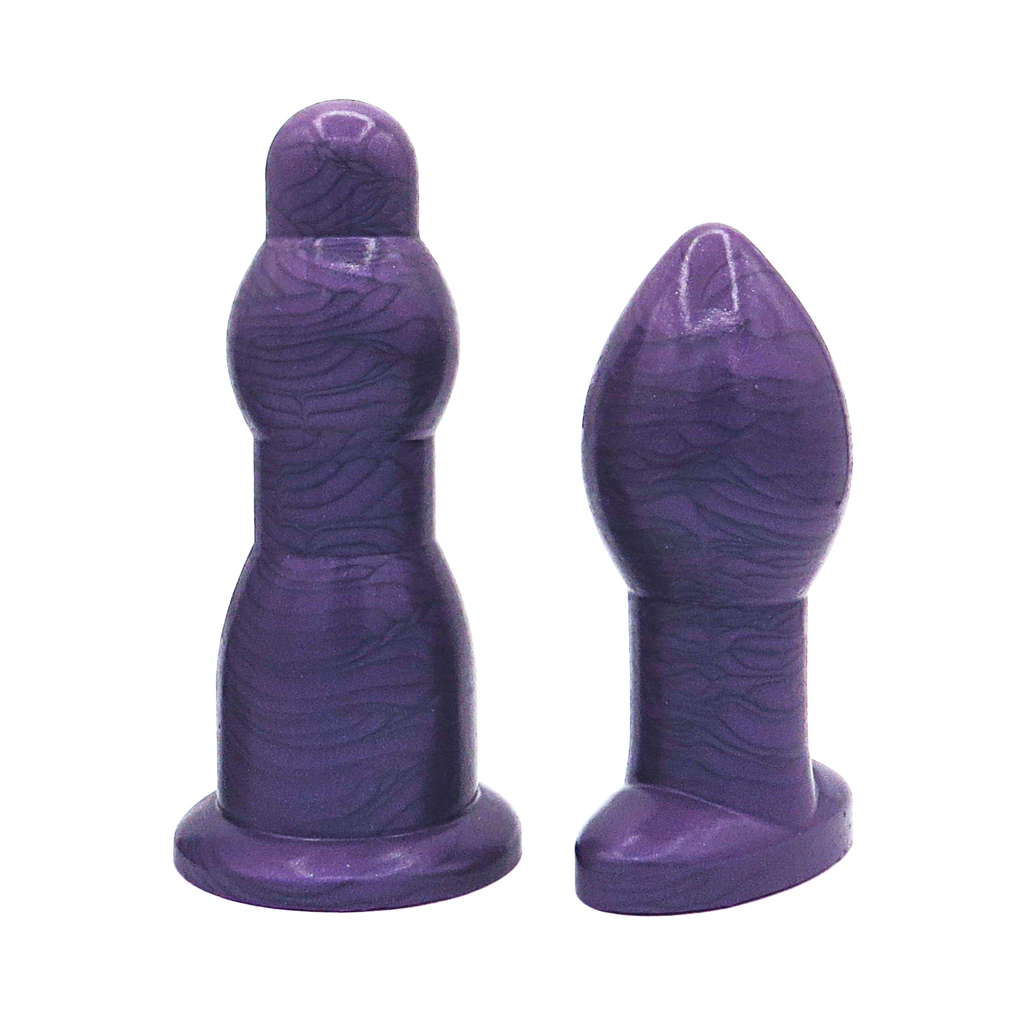 Image of a size 7 purple anal dilation wand and butt plug