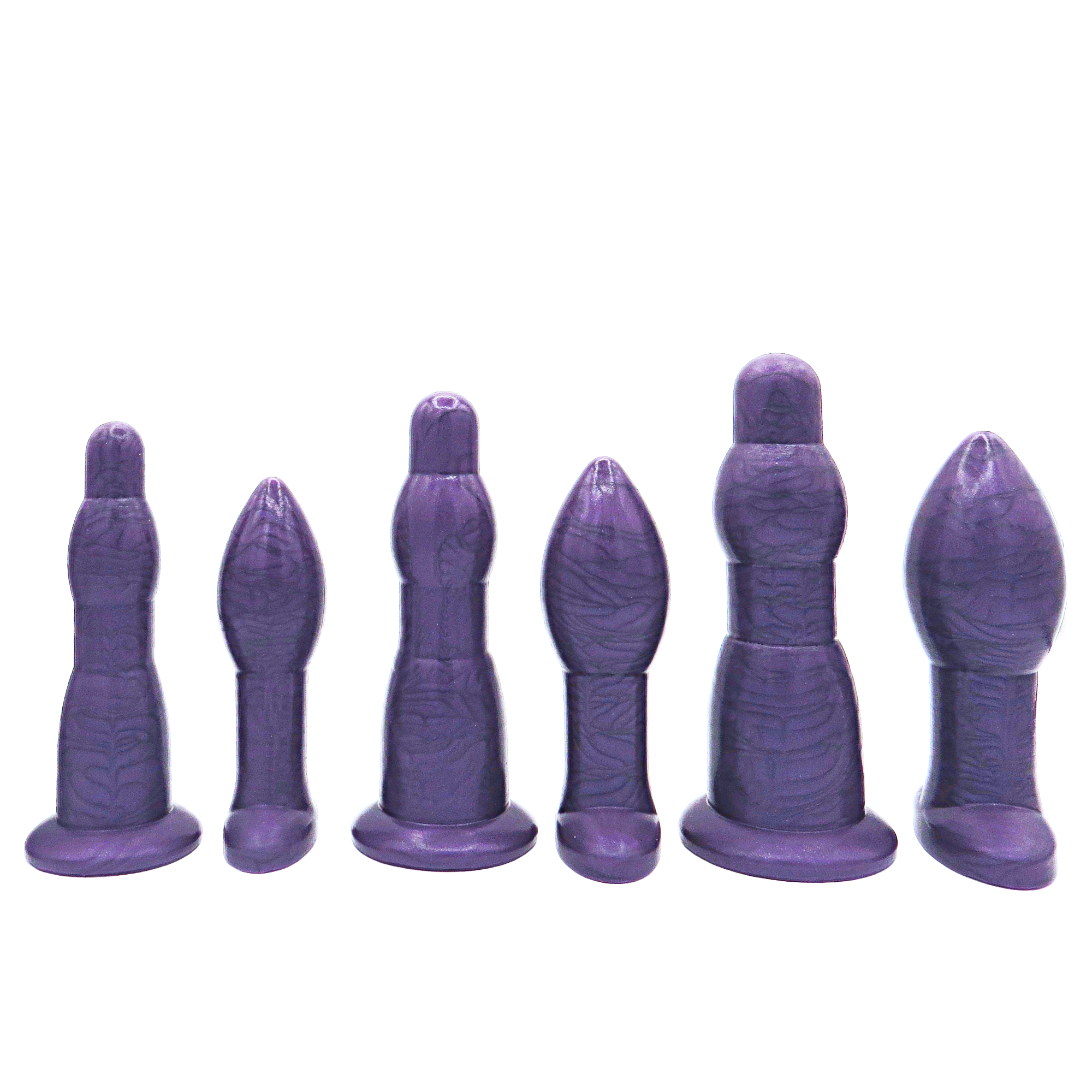 Image of a large purple anal training set with 3 anal dilation wands and 3 butt plugs in increasing sizes