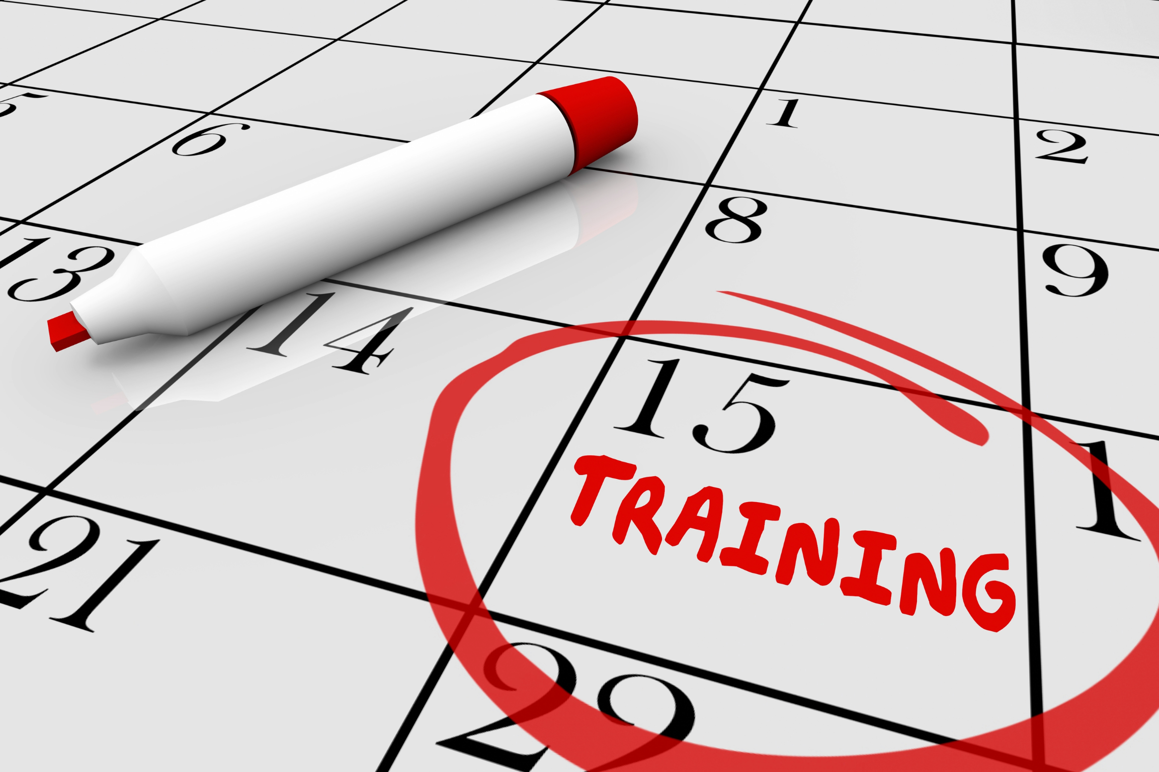 Image of a calendar and red marker. The 15th is circled and the word "Training" is written in the circle.
