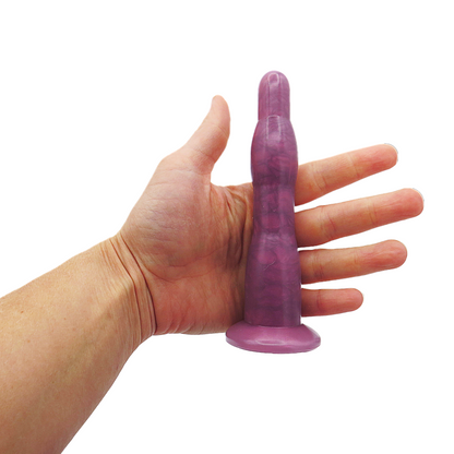Image of a rose long anal dilation wand in a hand